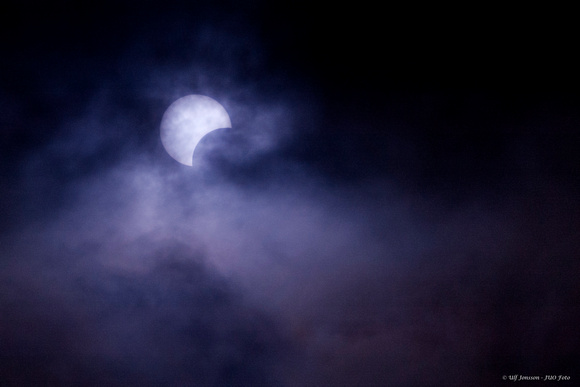 Partial Solar eclipse through clouds